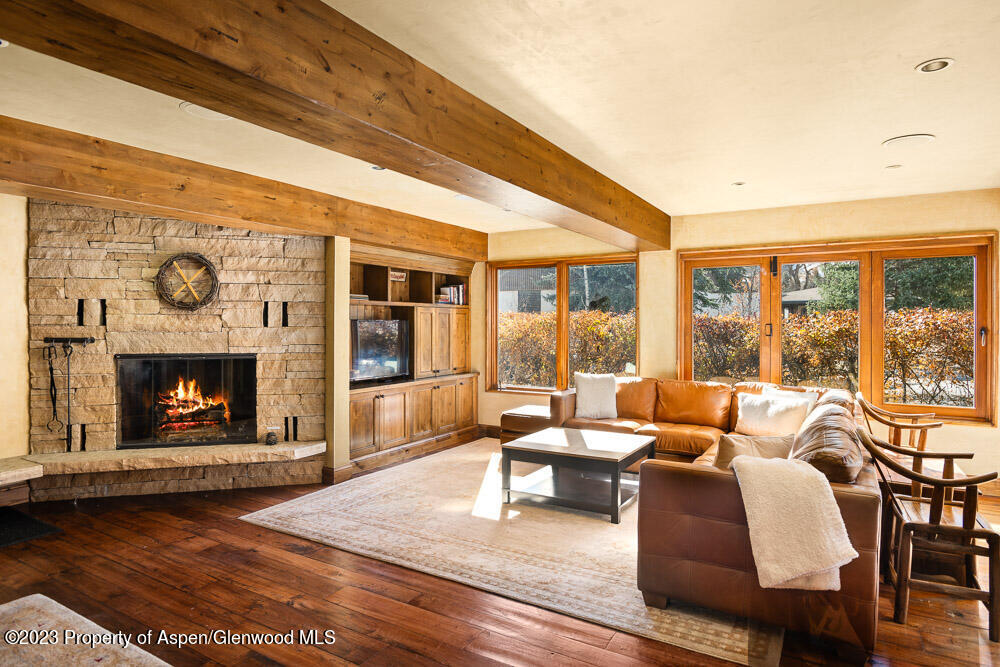 114 East Bleeker Street, Unit 102 Aspen, CO 81611 - Photo 3 of 21 a living room with furniture and a fireplace