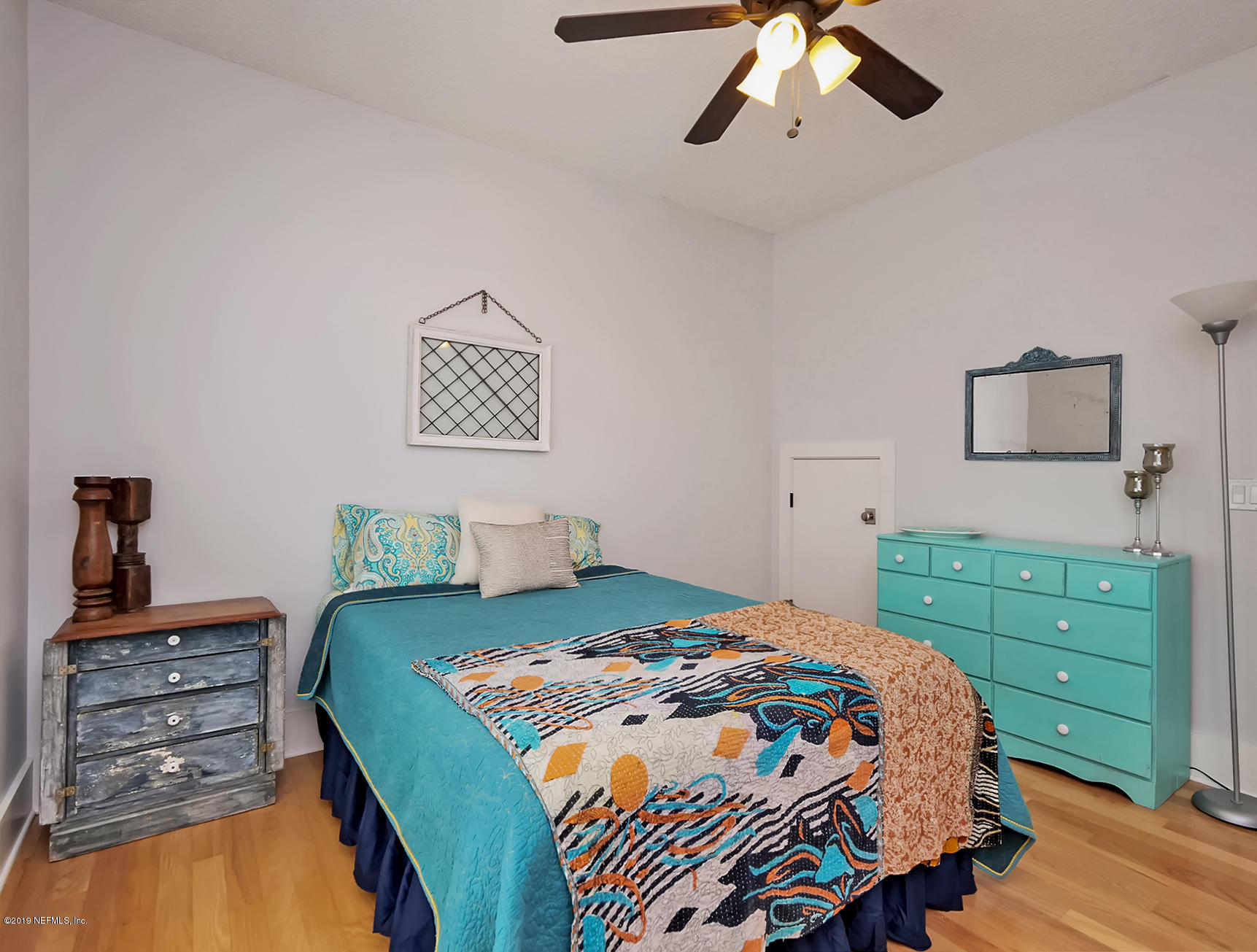 345 Ahern Street Atlantic Beach, FL 32233 - Photo 15 of 44 a bedroom with a bed and a dresser