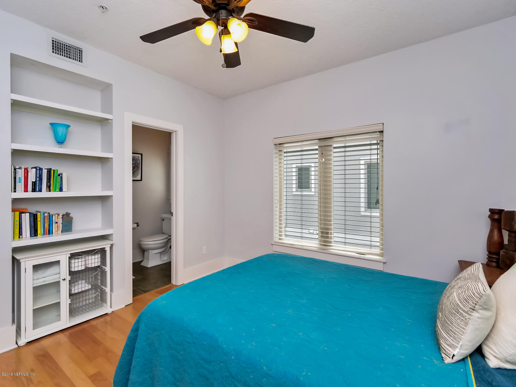 345 Ahern Street Atlantic Beach, FL 32233 - Photo 16 of 44 a bedroom with a bed and a large window