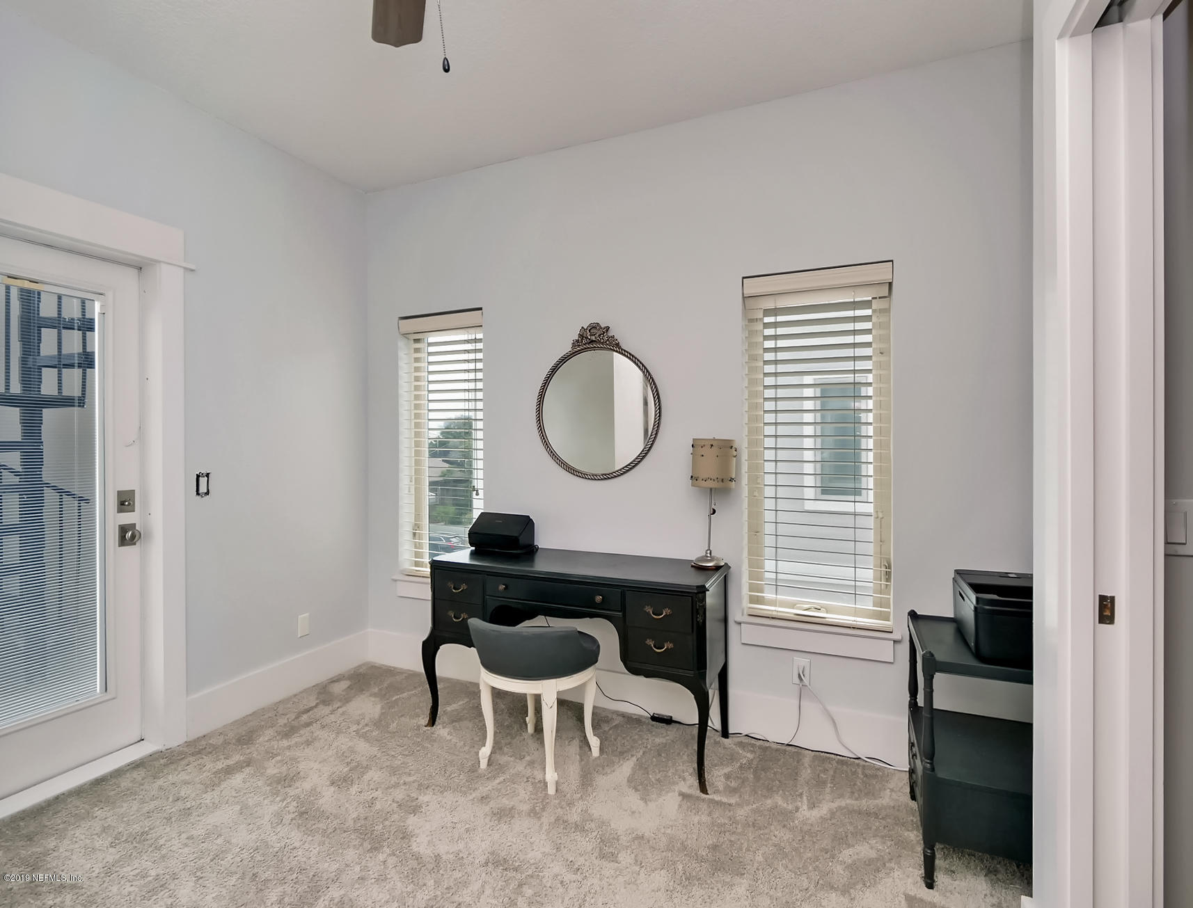 345 Ahern Street Atlantic Beach, FL 32233 - Photo 24 of 44 a living room with furniture a window and a potted plant