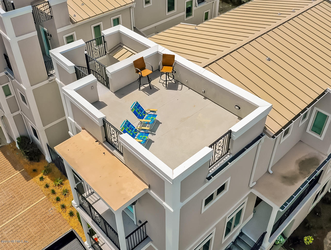 345 Ahern Street Atlantic Beach, FL 32233 - Photo 28 of 44 a roof deck with couch and chairs