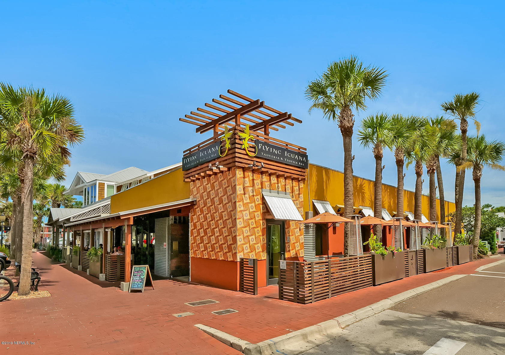 345 Ahern Street Atlantic Beach, FL 32233 - Photo 36 of 44 a view of a building with a palm tree