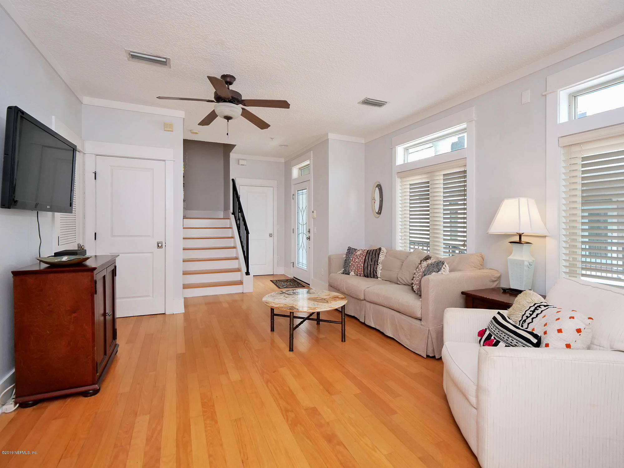 345 Ahern Street Atlantic Beach, FL 32233 - Photo 7 of 44 a living room with furniture and a flat screen tv