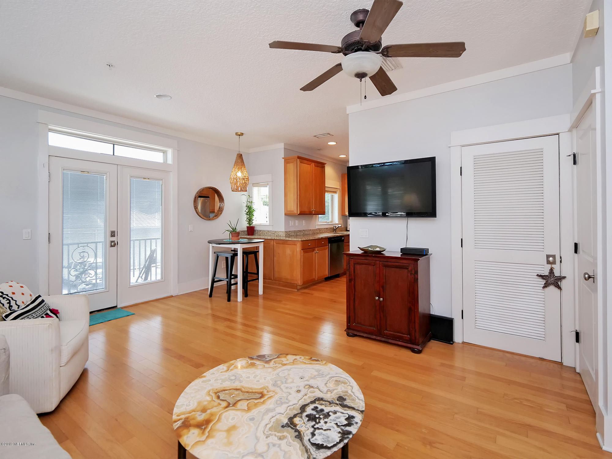 345 Ahern Street Atlantic Beach, FL 32233 - Photo 8 of 44 a living room with furniture and a flat screen tv