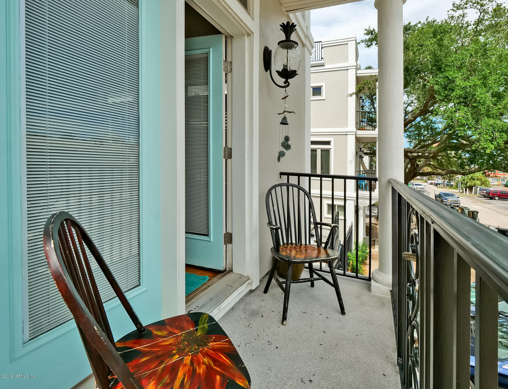 345 Ahern Street Atlantic Beach, FL 32233 - Photo 10 of 44 a view of a balcony with furniture and a gate
