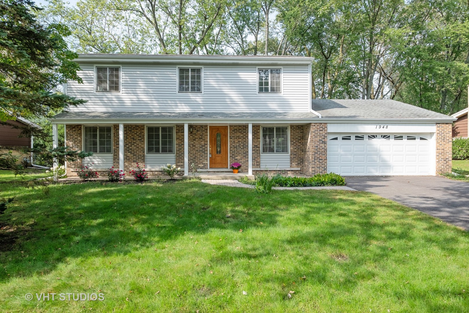 1948 Smith Road Northbrook, IL 60062 - Photo 1 of 1 a front view of a house with yard and green space