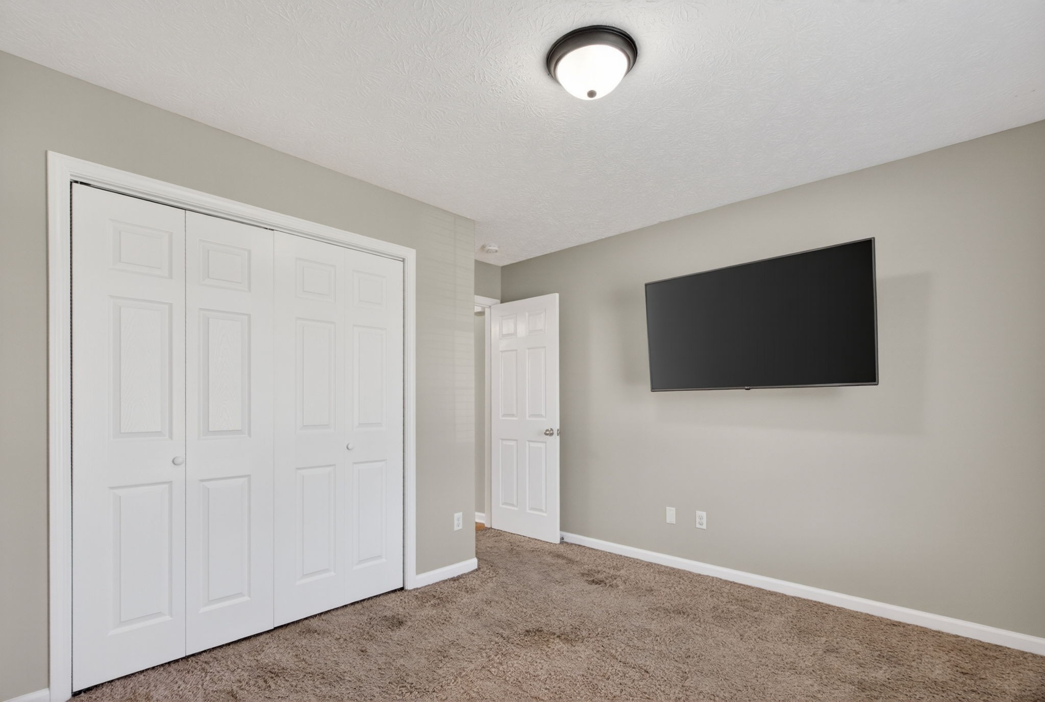 126 Hollands Way Portland, TN 37148 - Photo 29 of 42 an empty room with wooden floor and windows