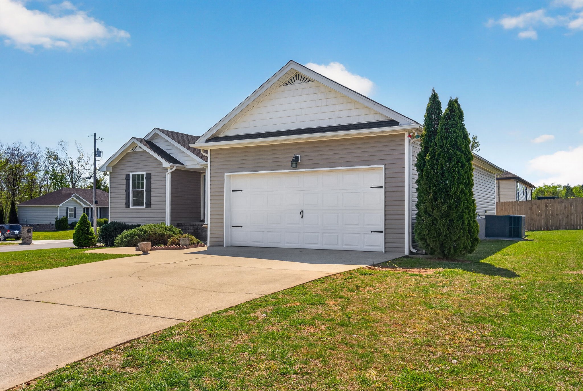 126 Hollands Way Portland, TN 37148 - Photo 3 of 42 a front view of a house with a yard and garage