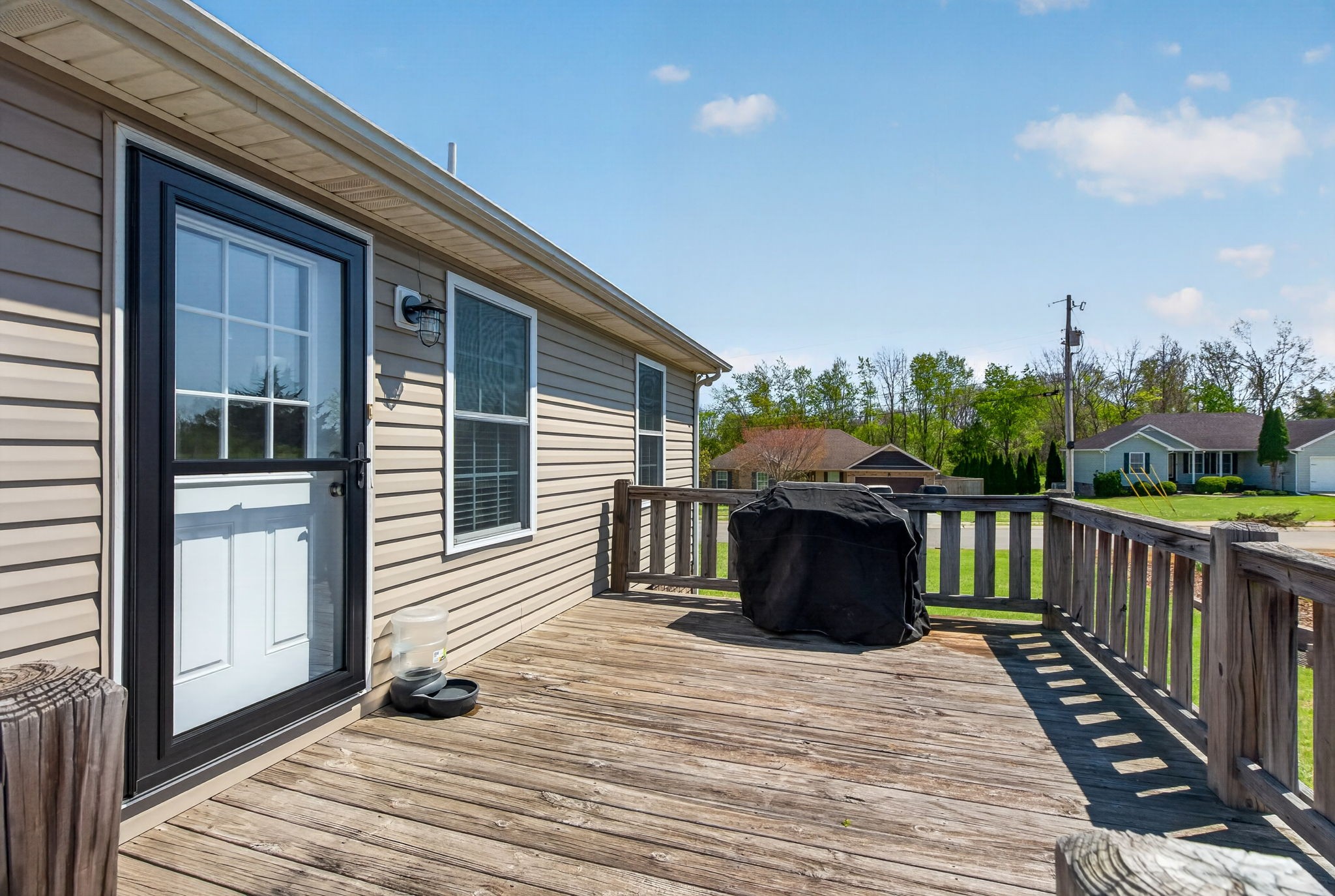 126 Hollands Way Portland, TN 37148 - Photo 37 of 42 a view of a deck with wooden floor and fence next to a yard