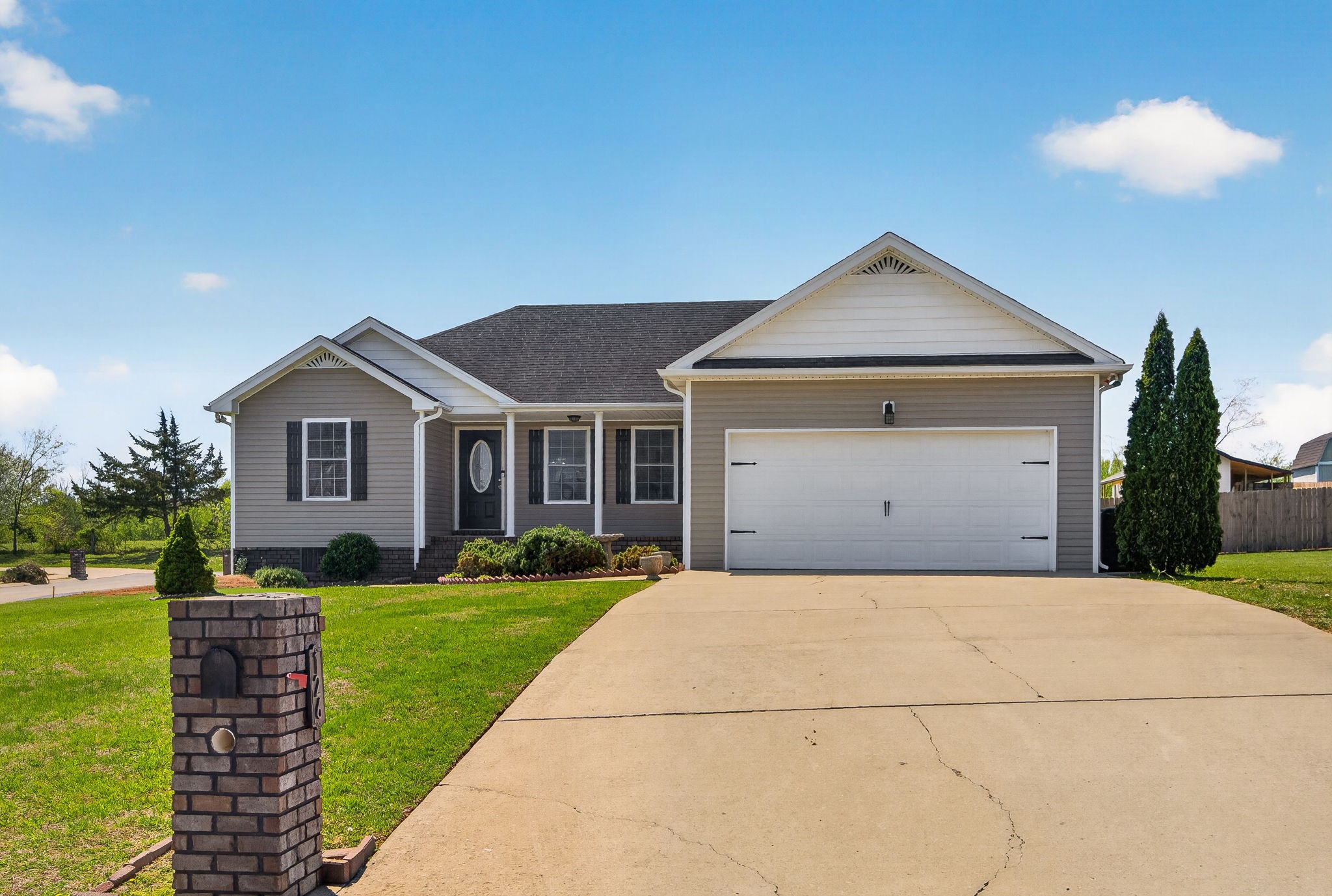 126 Hollands Way Portland, TN 37148 - Photo 4 of 42 a front view of a house with a yard and garage