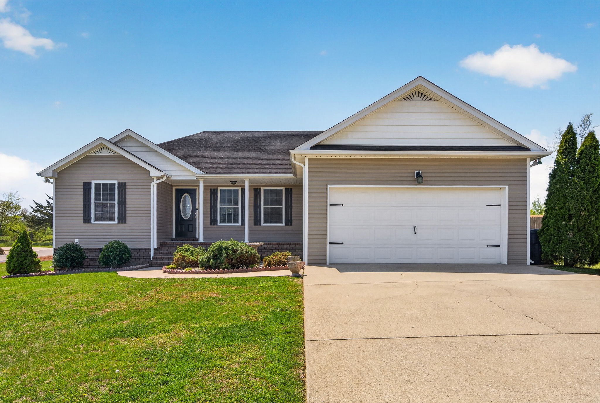 126 Hollands Way Portland, TN 37148 - Photo 6 of 42 a front view of a house with a garden