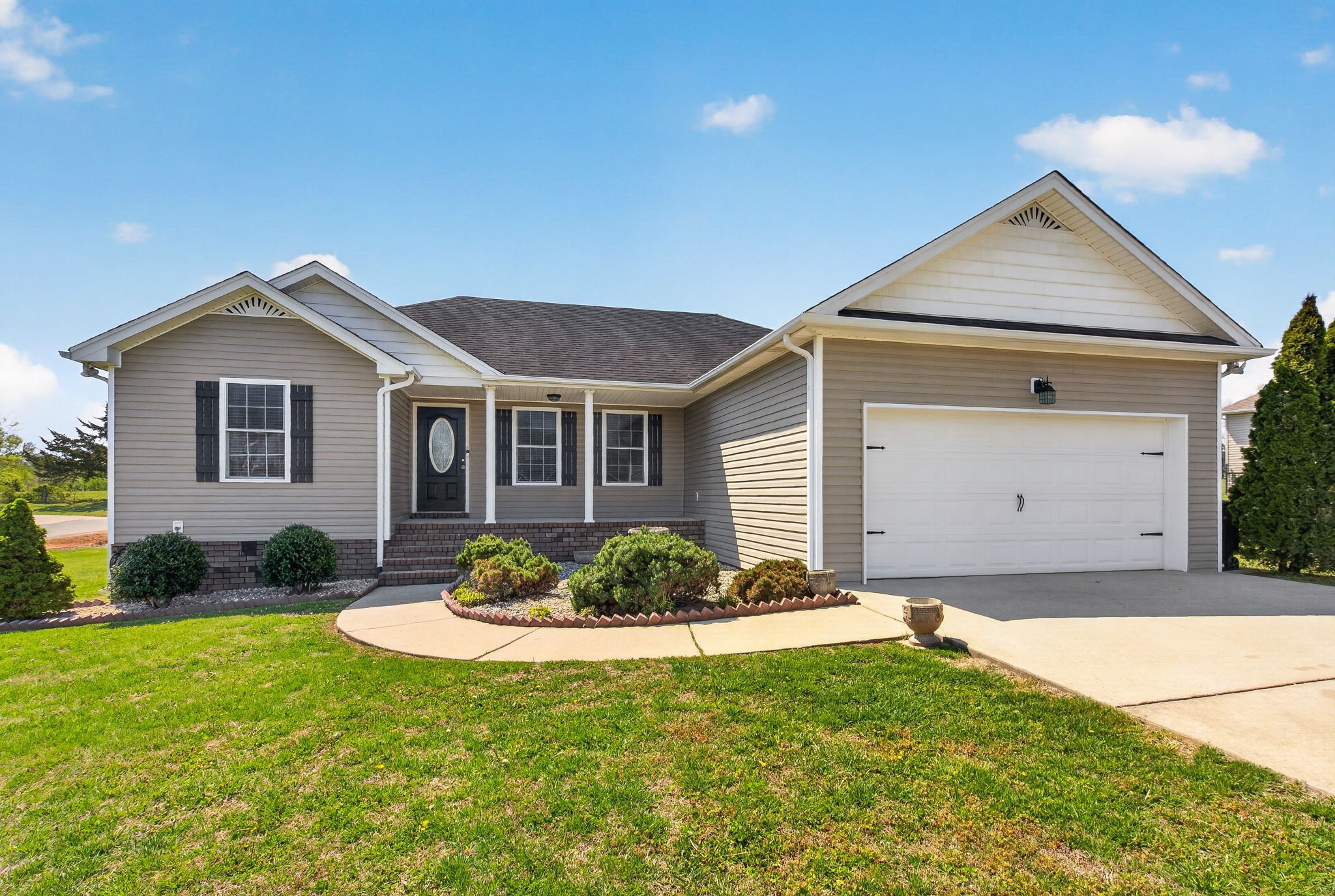 126 Hollands Way Portland, TN 37148 - Photo 7 of 42 a front view of a house with a yard