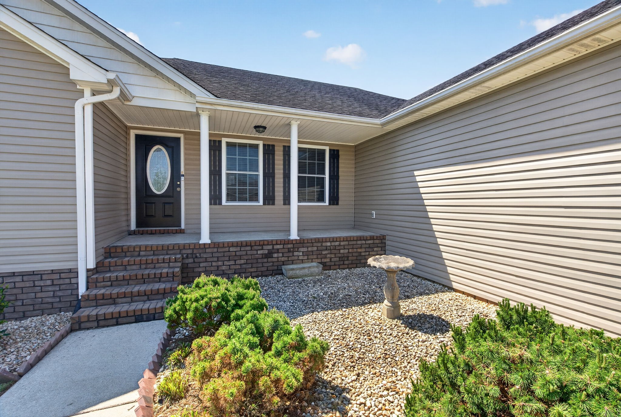 126 Hollands Way Portland, TN 37148 - Photo 8 of 42 a front view of a house with garden