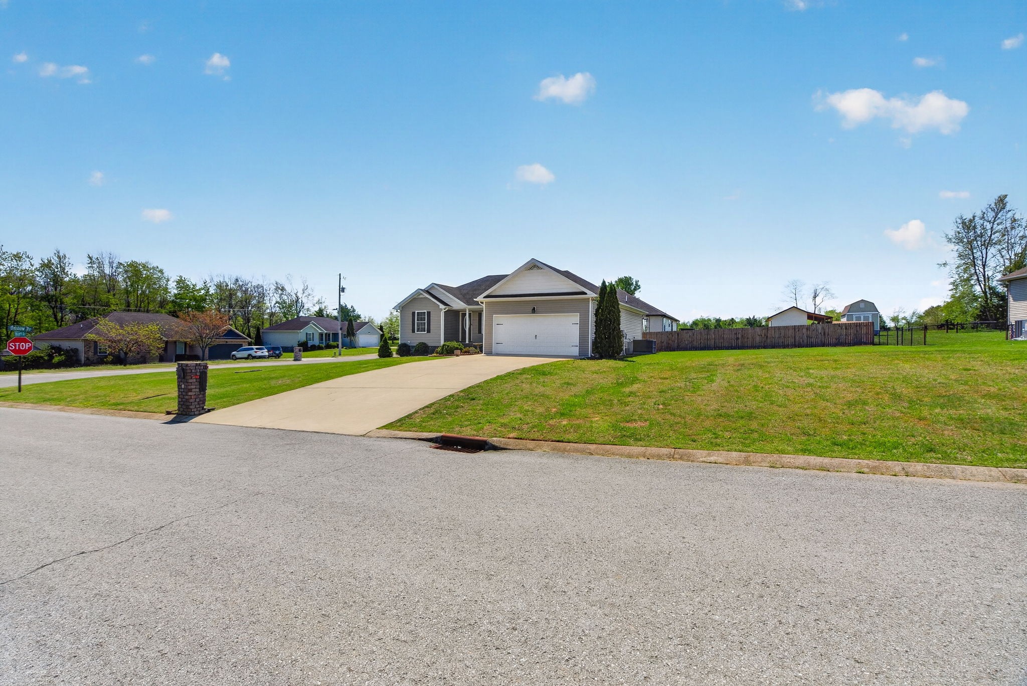 126 Hollands Way Portland, TN 37148 - Photo 9 of 42 a view of a house with a yard and a large tree