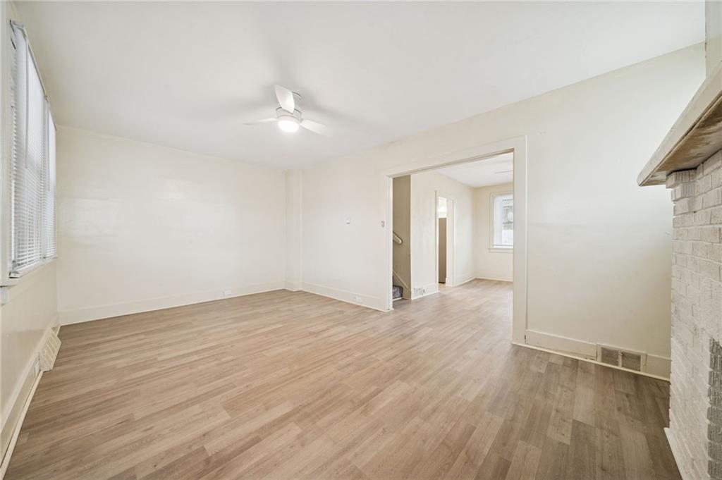 400 Broadway Avenue McKees Rocks, PA 15136 - Photo 11 of 34 an empty room with wooden floor and windows