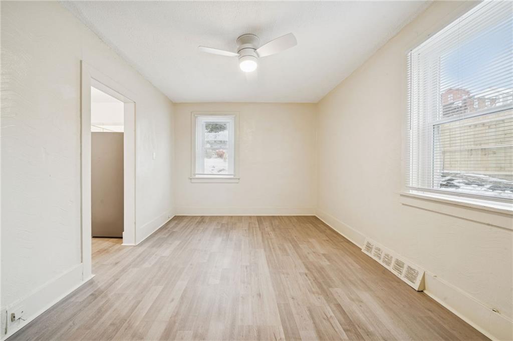 400 Broadway Avenue McKees Rocks, PA 15136 - Photo 12 of 34 an empty room with wooden floor and windows