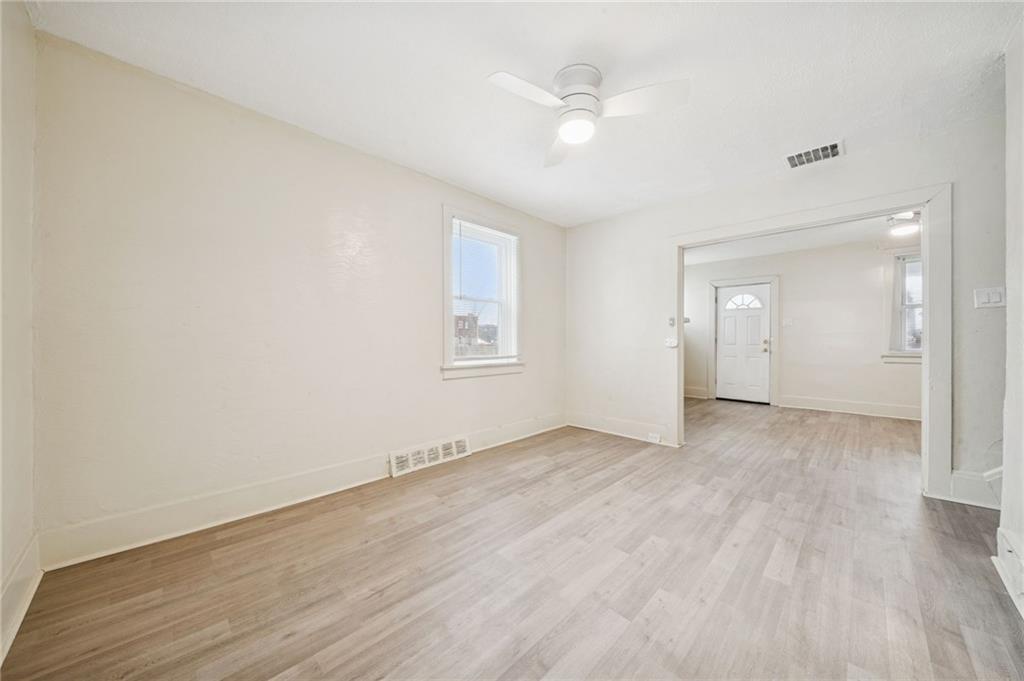 400 Broadway Avenue McKees Rocks, PA 15136 - Photo 13 of 34 an empty room with wooden floor and windows