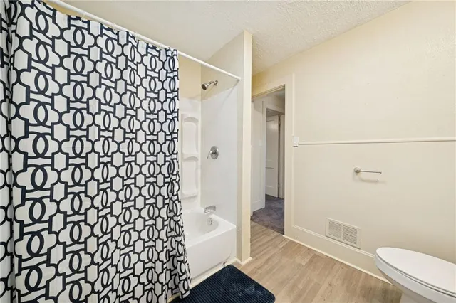 a bathroom with a shower curtain
