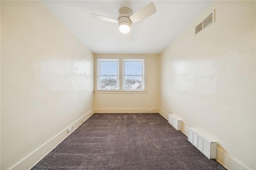 400 Broadway Avenue McKees Rocks, PA 15136 - Photo 19 of 34 an empty room with windows and fan