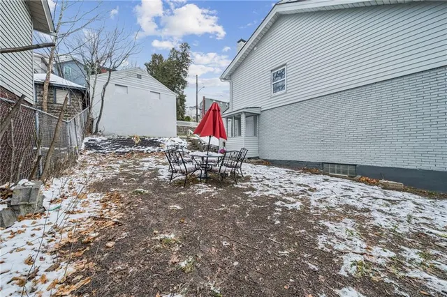 an aerial view of residential houses with city view