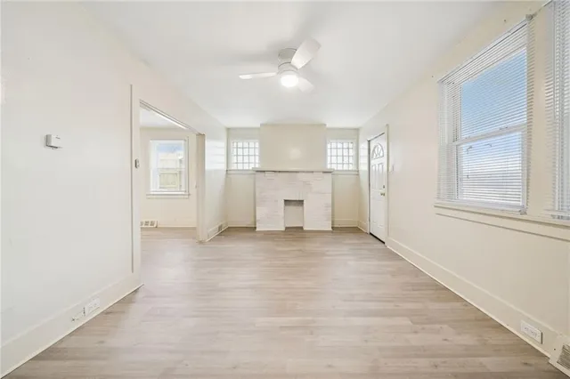 a view of an empty room with a window