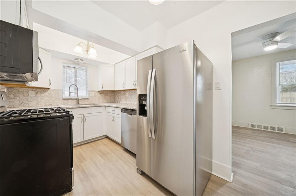 400 Broadway Avenue McKees Rocks, PA 15136 - Photo 7 of 34 a kitchen with a refrigerator stove and sink
