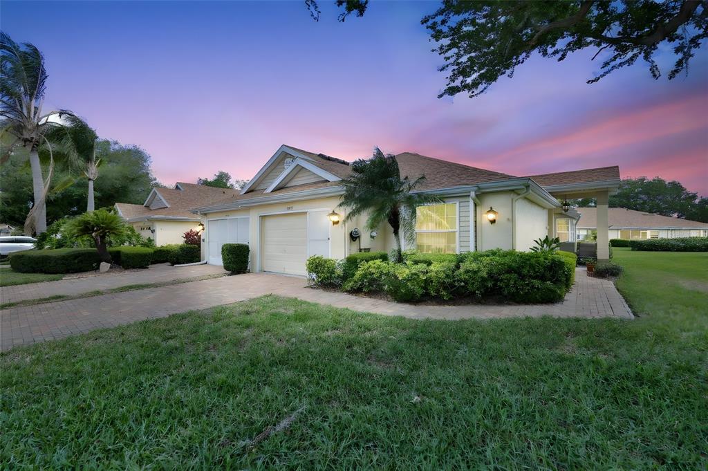 2012 Nantucket Drive, Unit 22 Sun City Center, FL 33573 - Photo 1 of 90 a front view of a house with a garden