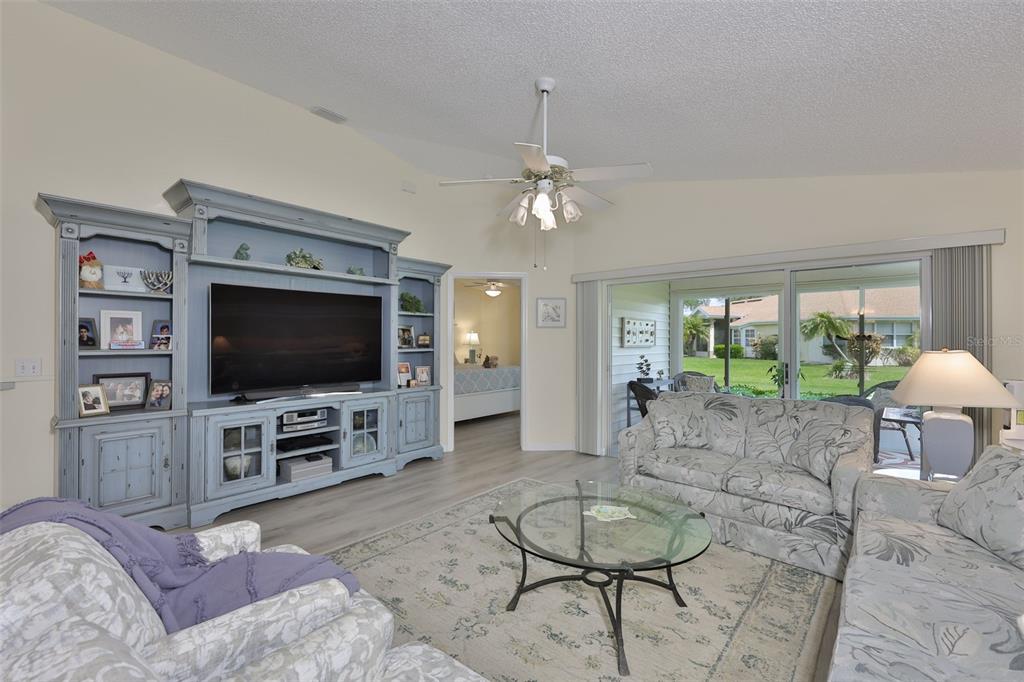 2012 Nantucket Drive, Unit 22 Sun City Center, FL 33573 - Photo 11 of 90 a living room with furniture and a flat screen tv