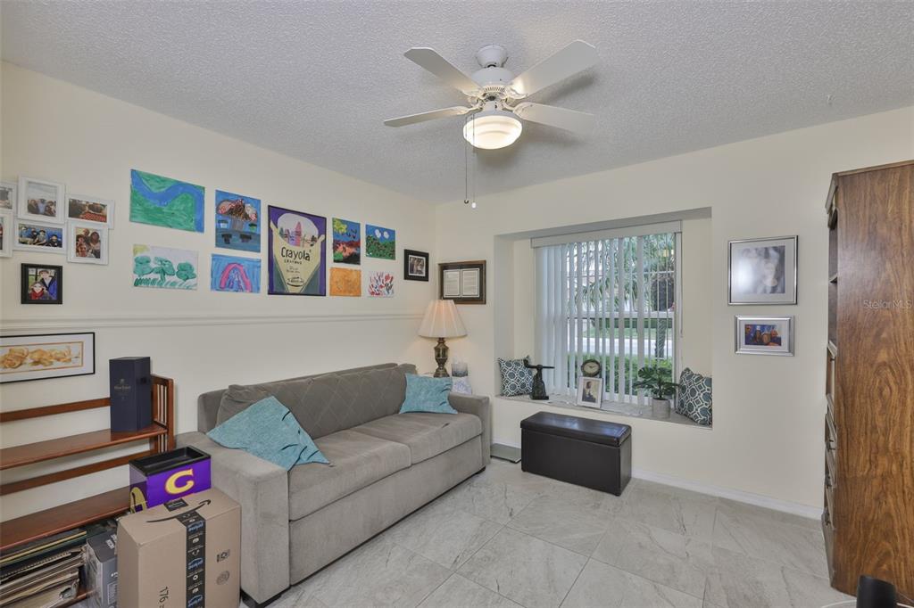 2012 Nantucket Drive, Unit 22 Sun City Center, FL 33573 - Photo 20 of 90 a living room with furniture and a window