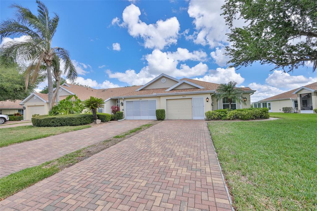 2012 Nantucket Drive, Unit 22 Sun City Center, FL 33573 - Photo 2 of 90 a front view of a house with garden