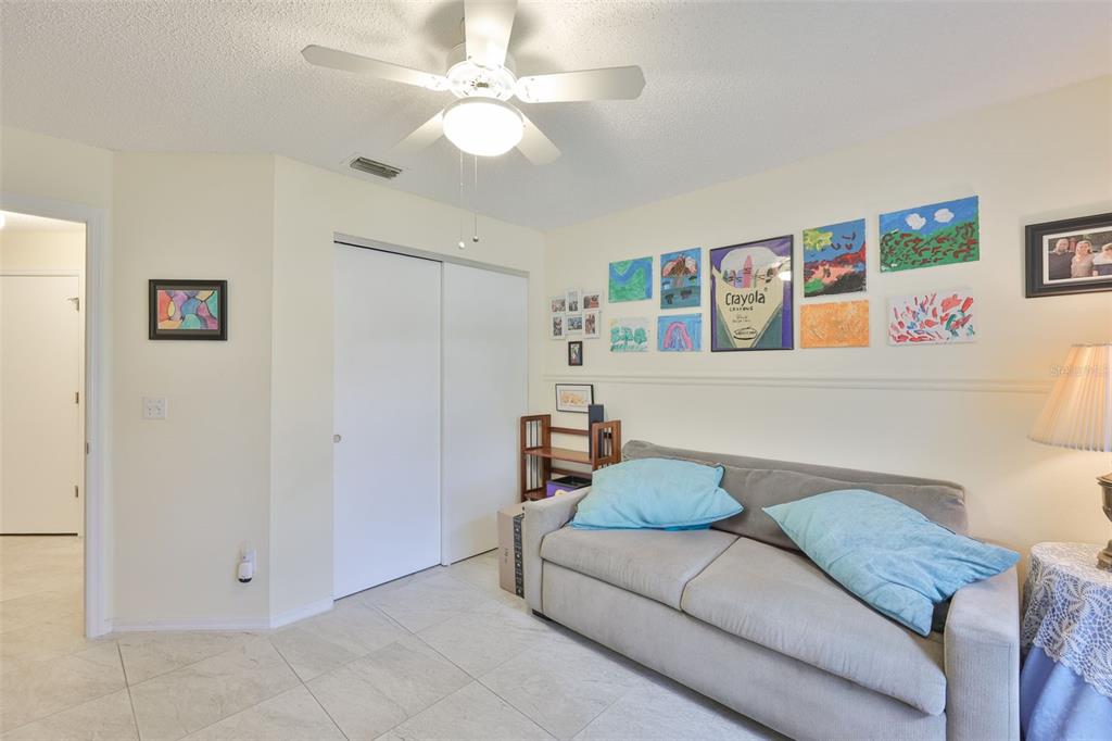 2012 Nantucket Drive, Unit 22 Sun City Center, FL 33573 - Photo 21 of 90 a living room with furniture and ceiling fan