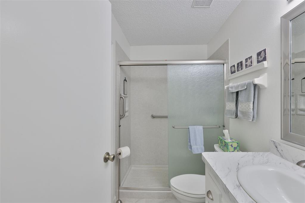 2012 Nantucket Drive, Unit 22 Sun City Center, FL 33573 - Photo 22 of 90 a bathroom with a sink toilet and shower