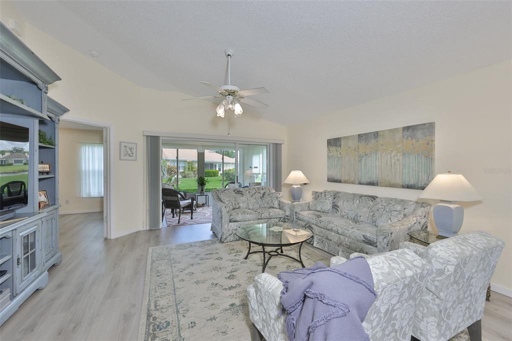 2012 Nantucket Drive, Unit 22 Sun City Center, FL 33573 - Photo 28 of 90 a living room with furniture and a fireplace
