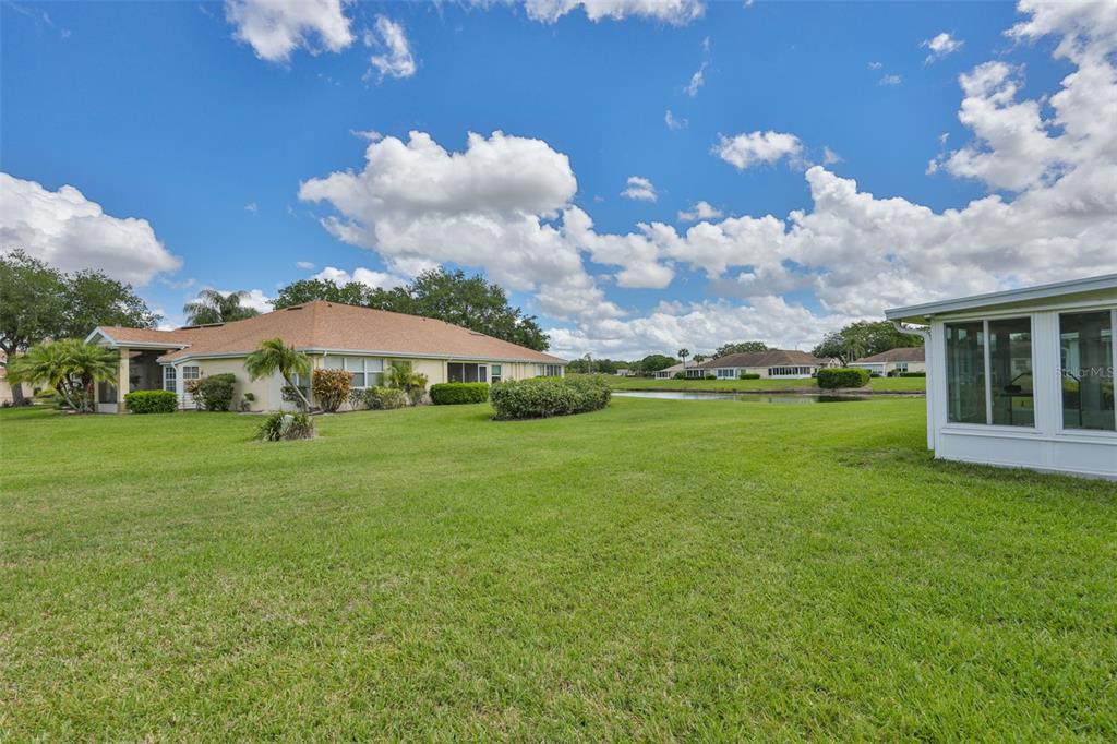 2012 Nantucket Drive, Unit 22 Sun City Center, FL 33573 - Photo 29 of 90 a view of a house with a backyard