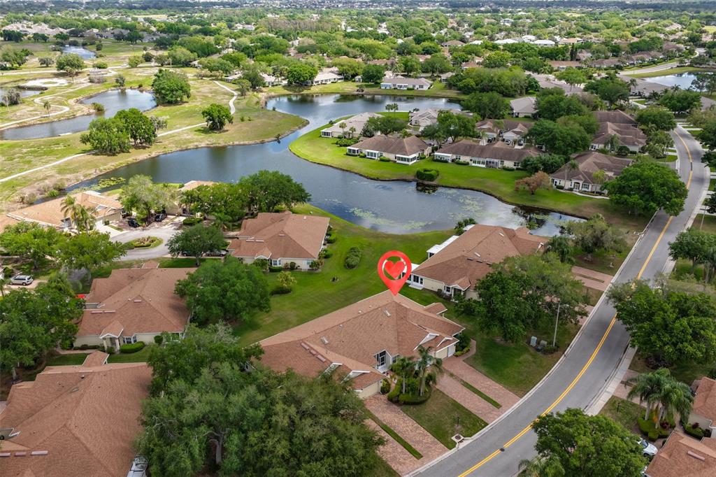 2012 Nantucket Drive, Unit 22 Sun City Center, FL 33573 - Photo 33 of 90 an aerial view of a city with lots of residential buildings ocean and mountain view in back