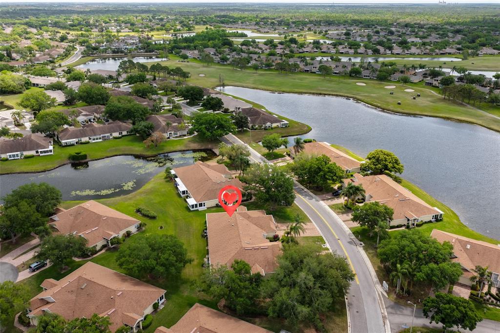 2012 Nantucket Drive, Unit 22 Sun City Center, FL 33573 - Photo 34 of 90 an aerial view of a city with lots of residential buildings ocean and mountain view in back