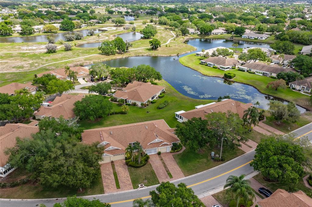 2012 Nantucket Drive, Unit 22 Sun City Center, FL 33573 - Photo 4 of 90 an aerial view of residential houses with outdoor space