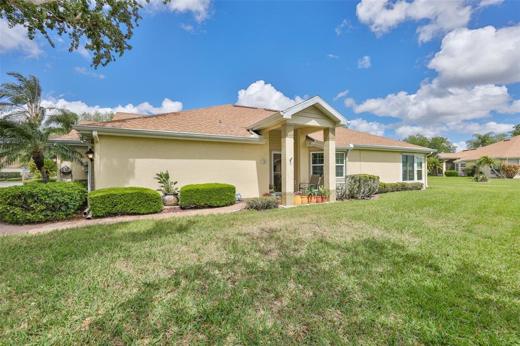 2012 Nantucket Drive, Unit 22 Sun City Center, FL 33573 - Photo 5 of 90 a front view of a house with a yard and garage