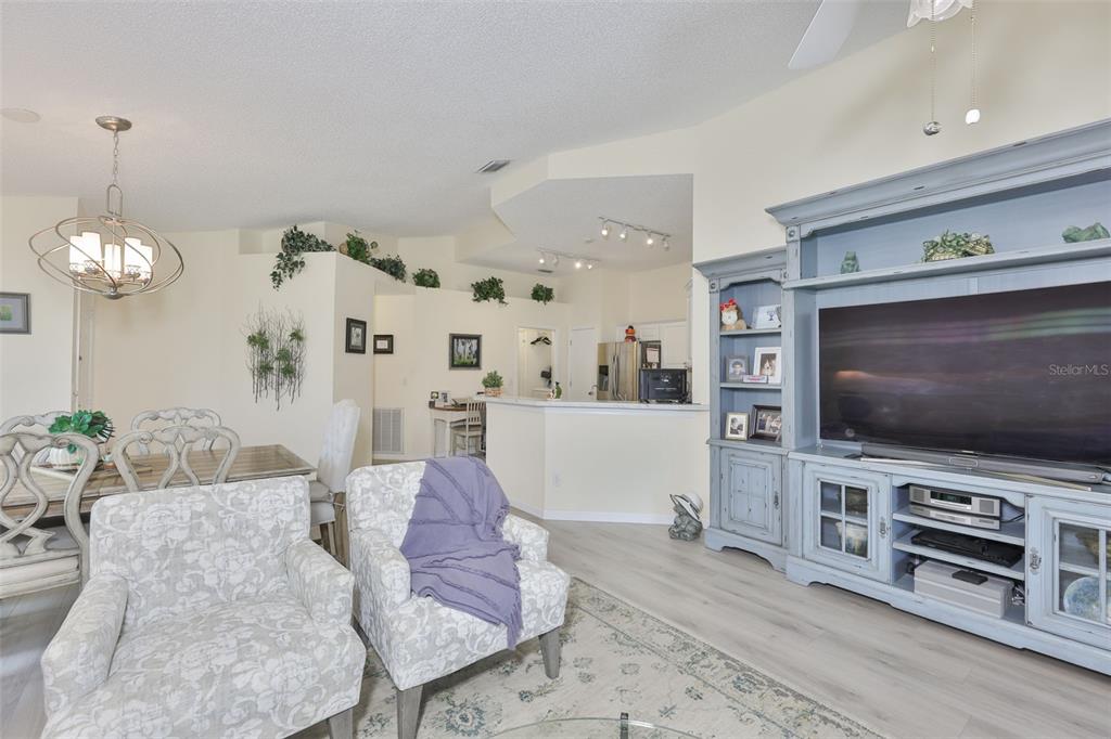 2012 Nantucket Drive, Unit 22 Sun City Center, FL 33573 - Photo 6 of 90 a living room with furniture and a flat screen tv
