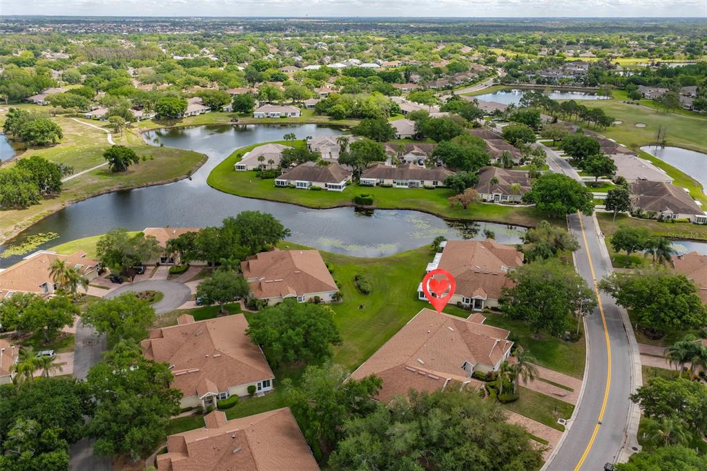 2012 Nantucket Drive, Unit 22 Sun City Center, FL 33573 - Photo 89 of 90 an aerial view of residential houses with outdoor space and lake view