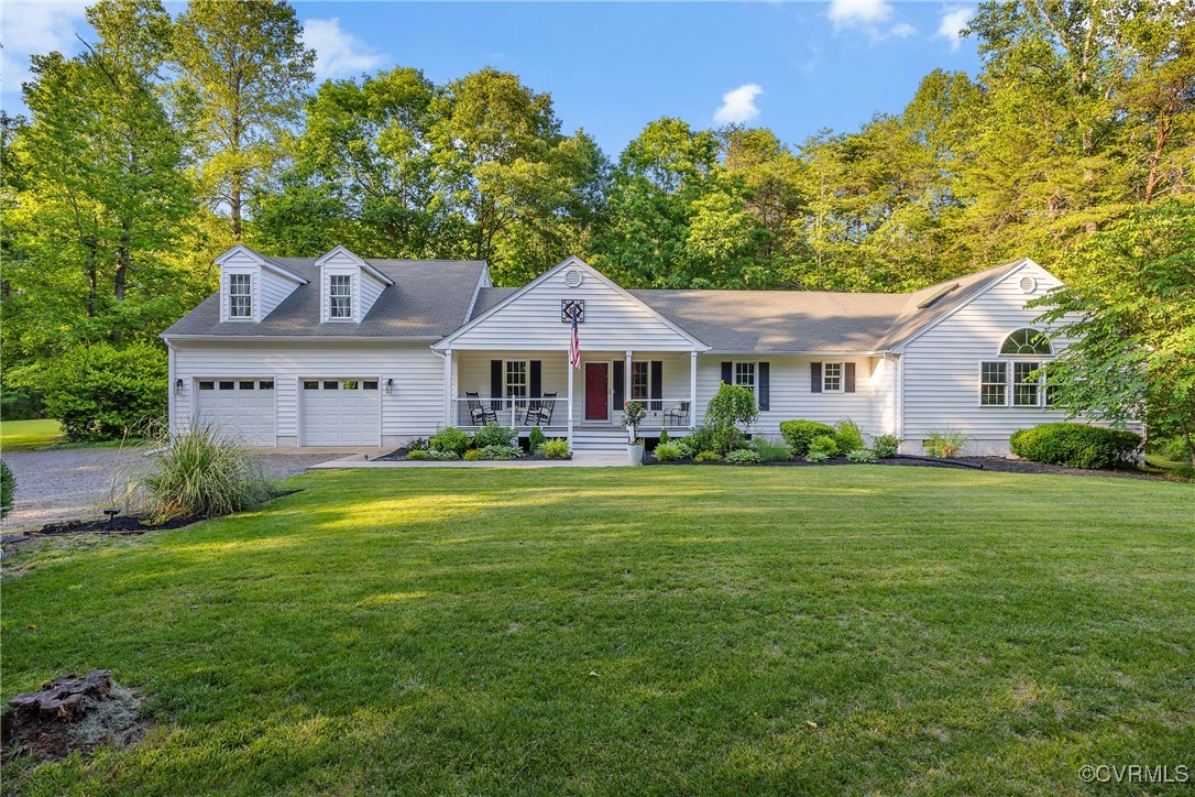 3924 Whitehall Road Sandy Hook, VA 23153 - Photo 1 of 50 a front view of a house with a garden