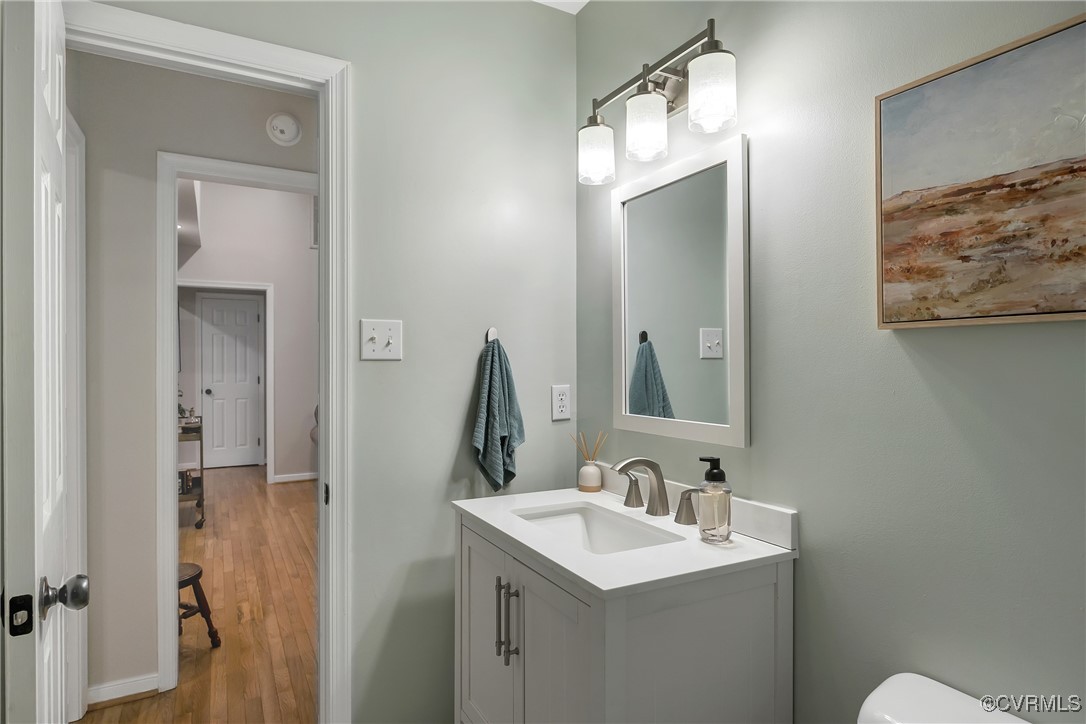 3924 Whitehall Road Sandy Hook, VA 23153 - Photo 16 of 50 a bathroom with a toilet sink and mirror