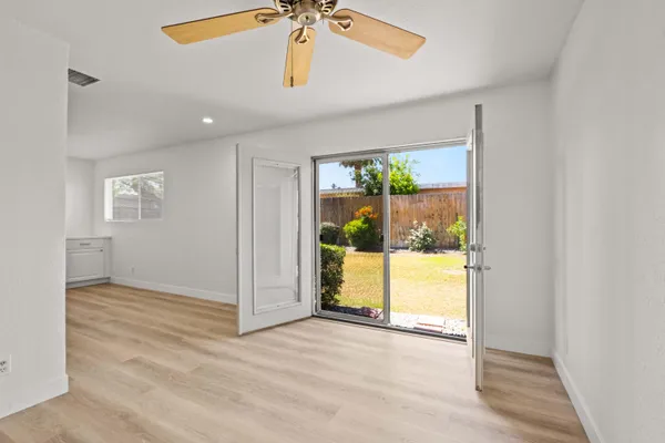 en empty room with window and glass door