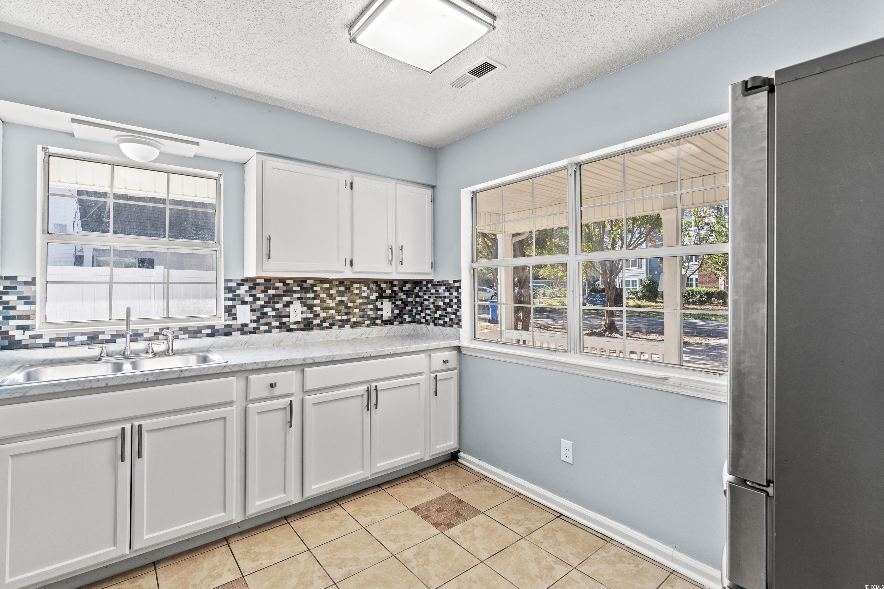 1024 Futrell Drive, Unit 1024 Myrtle Beach, SC 29577 - Photo 15 of 20 Kitchen featuring stainless steel refrigerator, wh