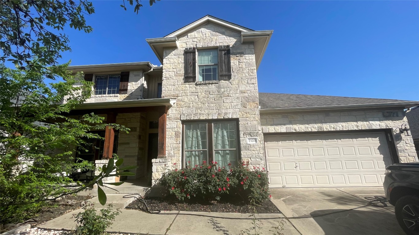 7320 Moon Rock Road Austin, TX 78739 - Photo 1 of 1 a front view of a house with garden
