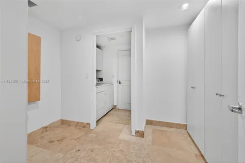 a front view of a house with a yard and fountain