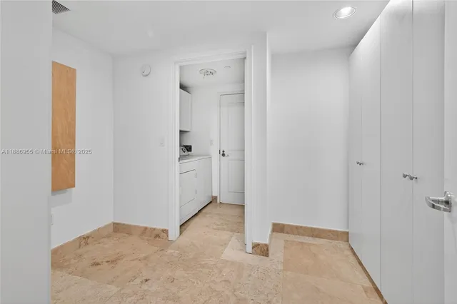 a front view of a house with a yard and fountain