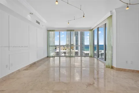 an empty room with an empty space and windows