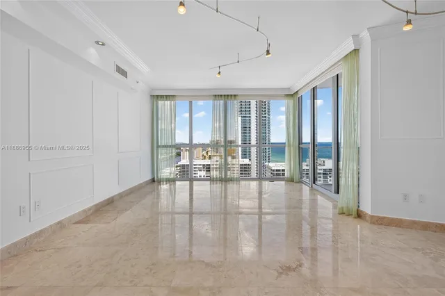 an empty room with an empty space and windows