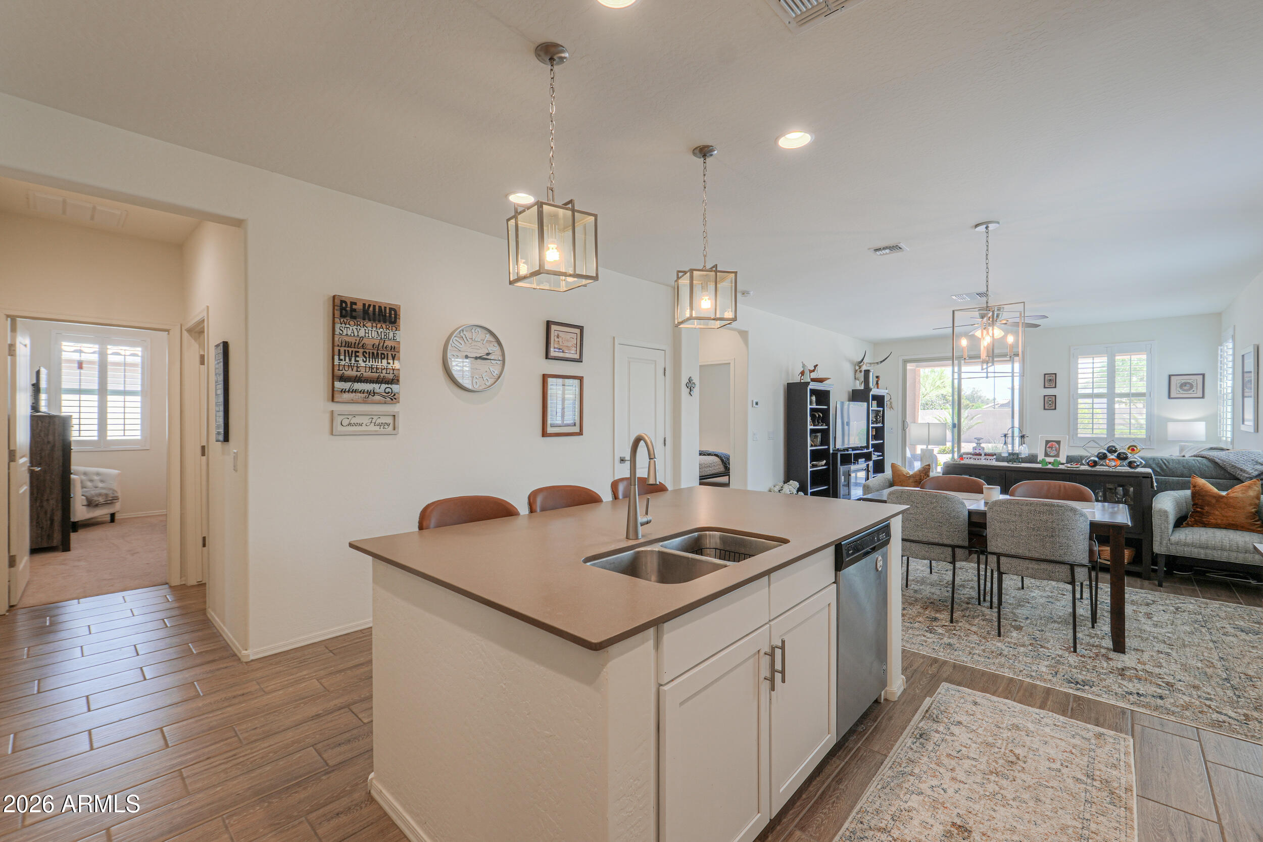 42085 West Cribbage Road Maricopa, AZ 85138 - Photo 11 of 35 a kitchen with center island a sink appliances and a counter top space